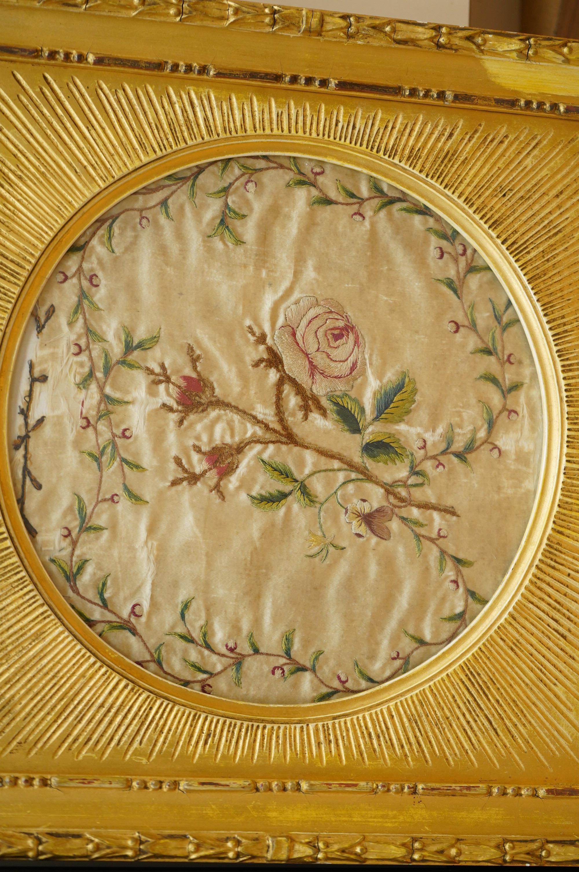 A late 18th century polychrome floral silk work embroidery of a cornucopia of flowers and a butterfly above, dated 1770, together with an early 19th century embroidery of a spray of roses surrounded by a floral border, w